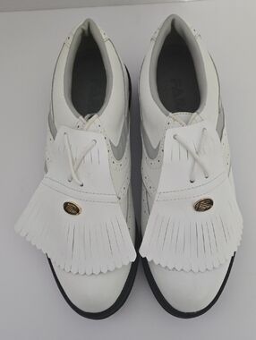 White Fringe Kiltie Golf Sneaker with Gold Oval Accent